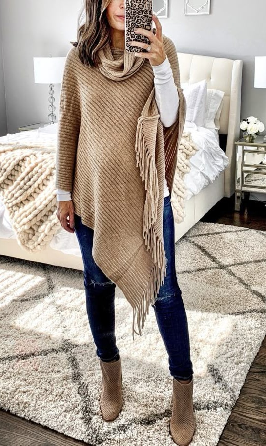 2. Camel Fringe Poncho Over Distressed Skinny Jeans and Ankle Booties