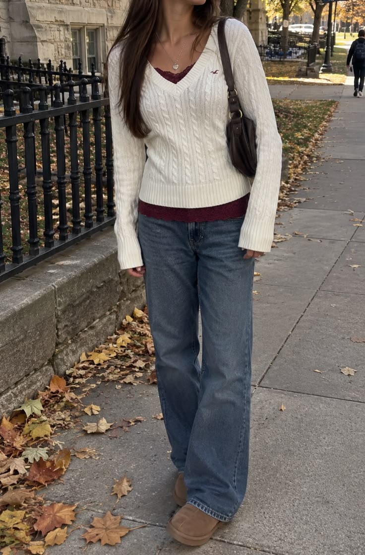 7. Cream V-Neck Cable Sweater Over Burgundy Lace Cami and Wide-Leg Jeans