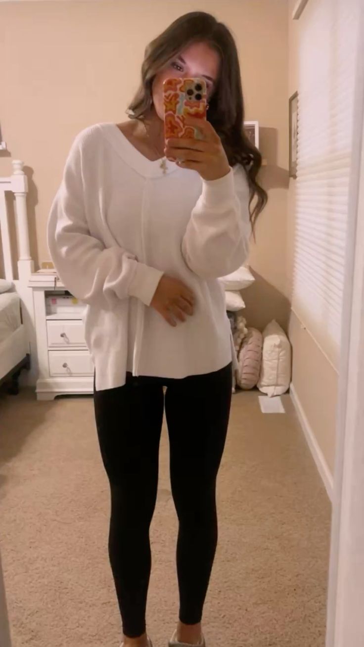 15. White Waffle-Knit V-Neck Tunic With Black Leggings