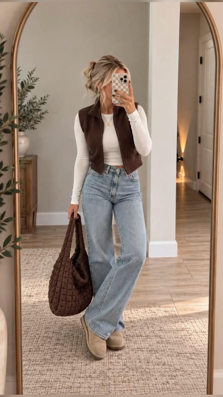 2. Chocolate Sherpa Vest With Light-Wash Wide-Leg Jeans and Suede Boots