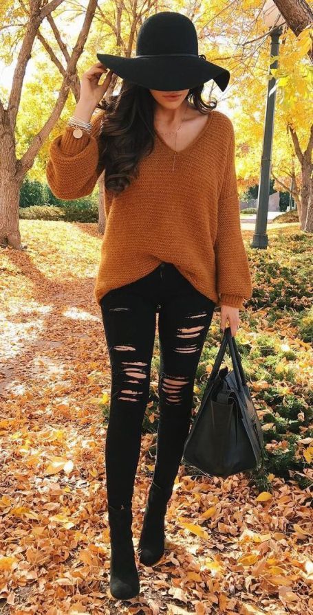 11. Caramel V-Neck Sweater With Black Ripped Skinny Jeans and Floppy Hat