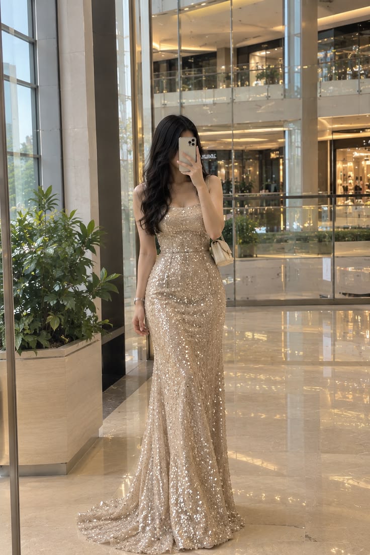5. Champagne Sequin Mermaid Gown Paired With a Cream Quilted Mini Bag