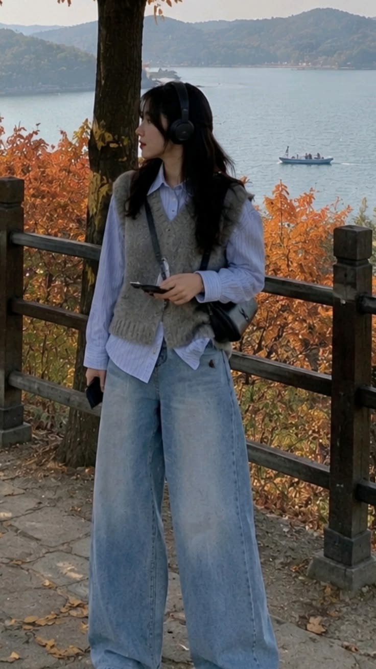 14. Blue Pinstripe Shirt Under a Grey Knit Vest With Baggy Jeans