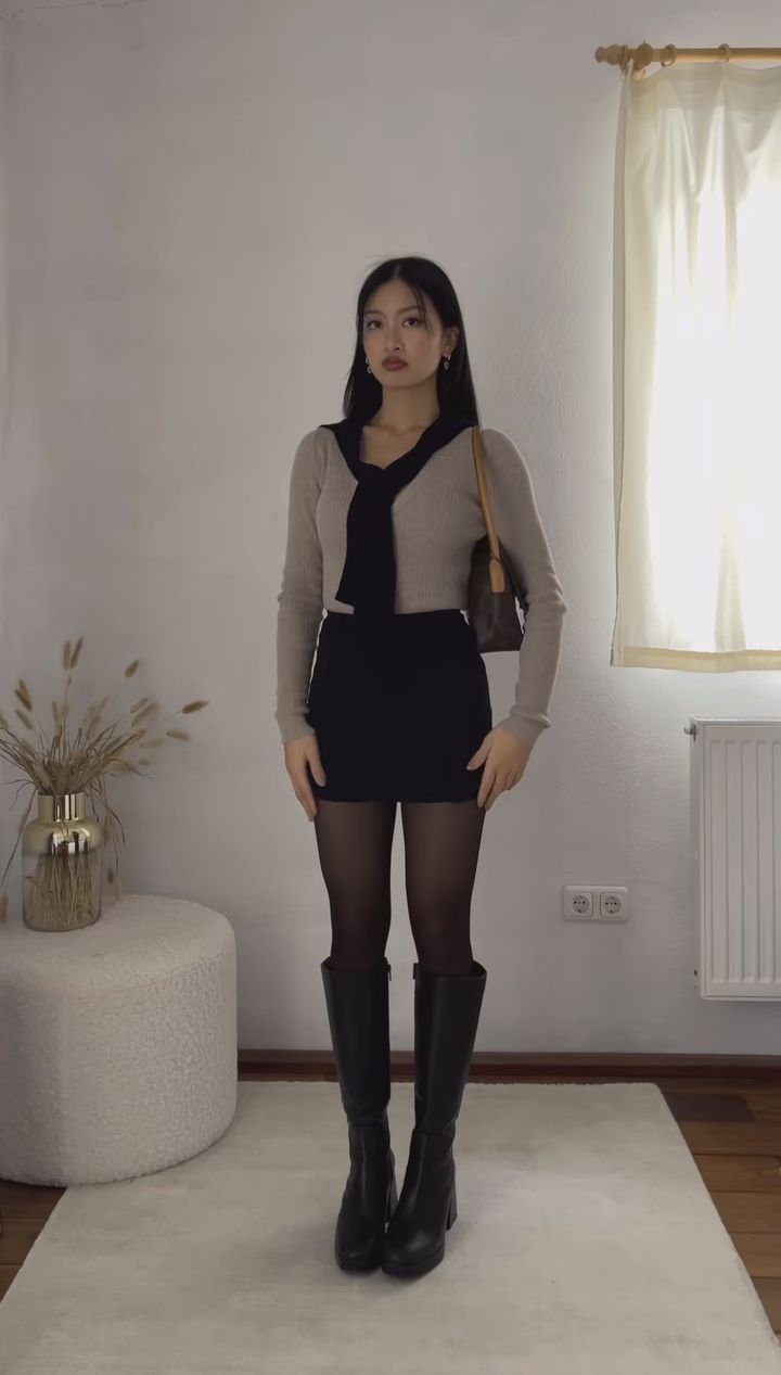 17. Taupe Ribbed Cardigan With a Black Sweater Tied Over the Shoulders