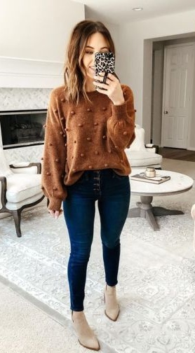 16. Cinnamon Pom-Pom Sweater, Button-Fly Skinny Jeans, and Taupe Booties