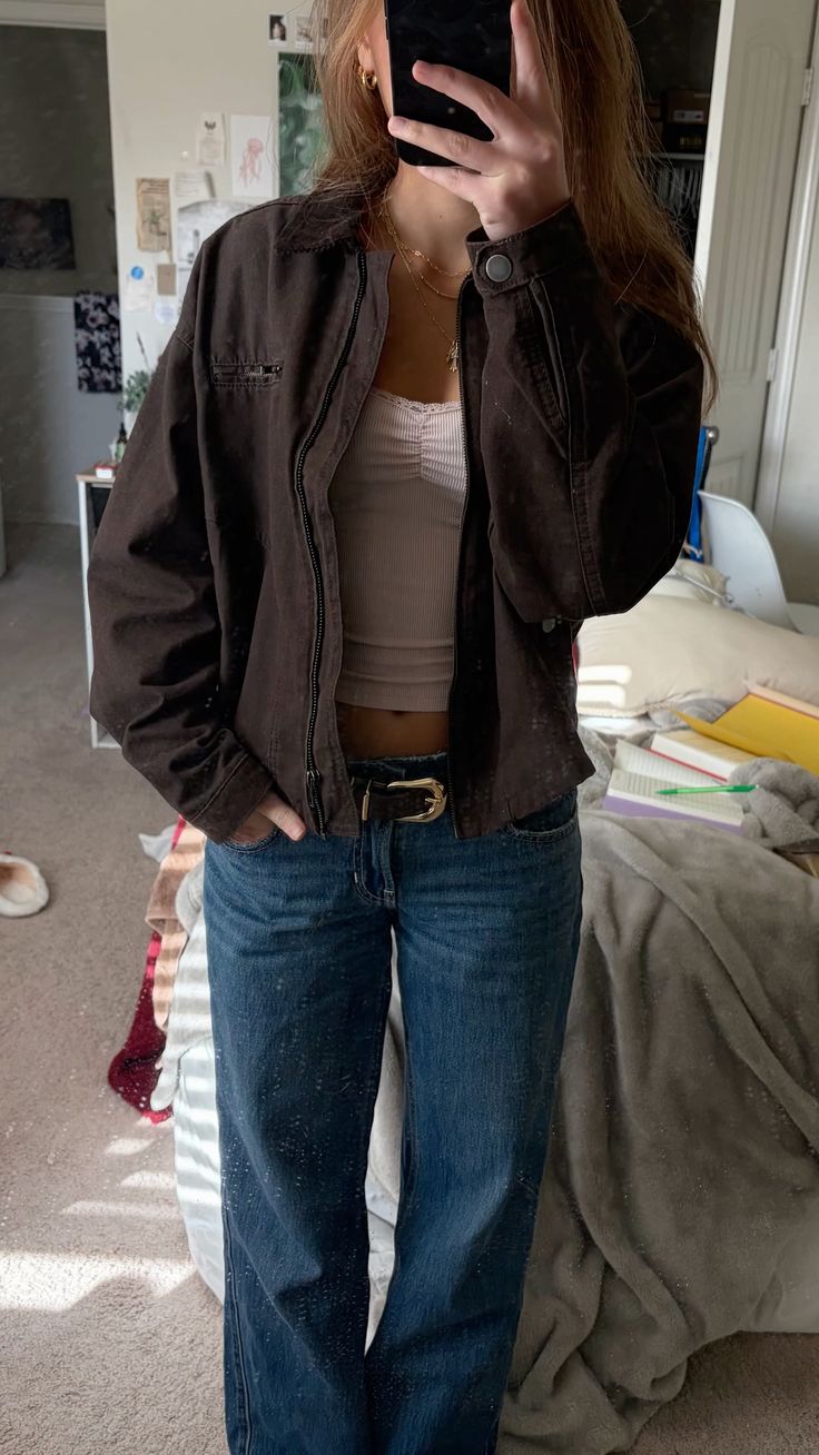 12. Rugged Brown Canvas Work Jacket Over a Ruched Cami and Low-Rise Jeans
