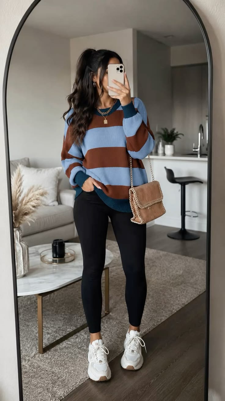 15. Blue and Rust Striped Sweater With Black Leggings and Chunky White Sneakers